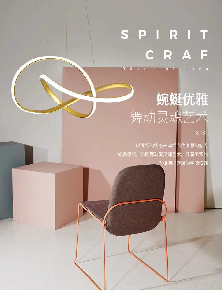 Dining room pendant lamp with white and gold interlocking loops in a modern Nordic design
