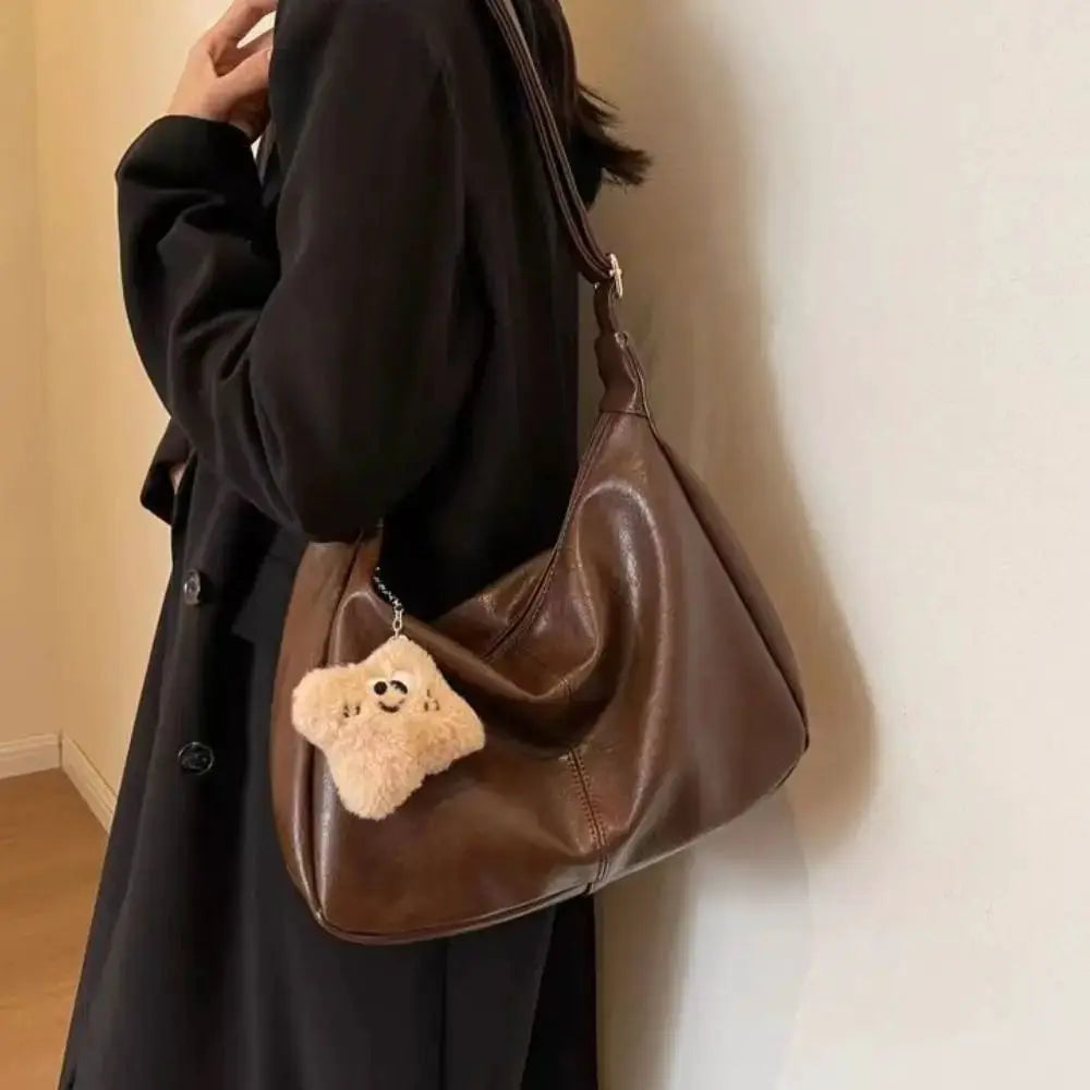 Brown PU leather slouchy shoulder bag with large capacity and beige fluffy keychain charm