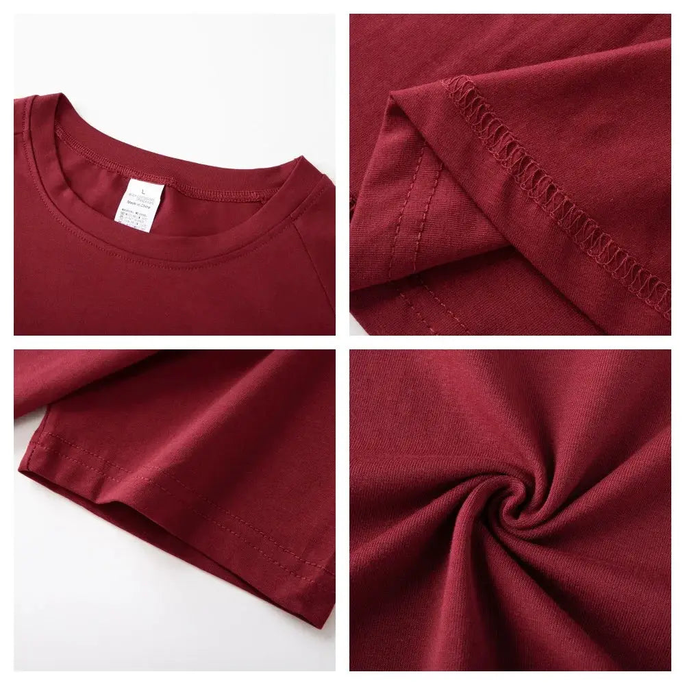Men's burgundy cotton plain short-sleeve T-shirt for gym, slim fit; close-up of fabric and stitching.