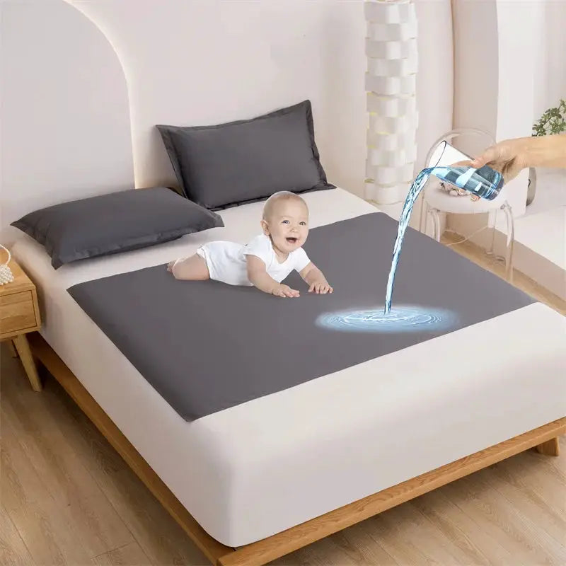 Simples Market TPU waterproof bed flat sheet in gray on a bed with a baby