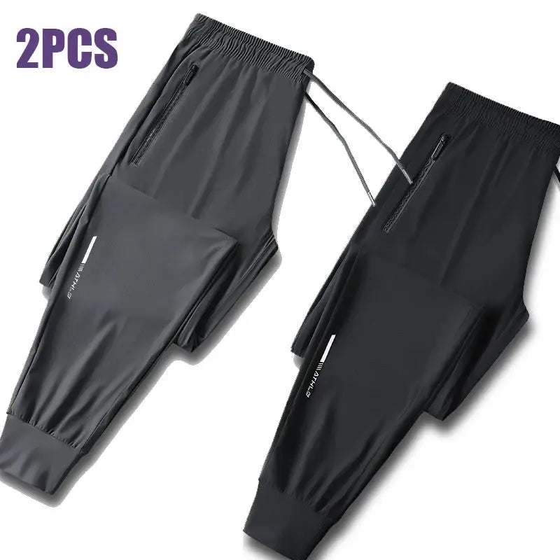 2-pack men's ice silk pants by Simples Market; gray and black, quick-dry, zip pockets joggers with drawstring waist.