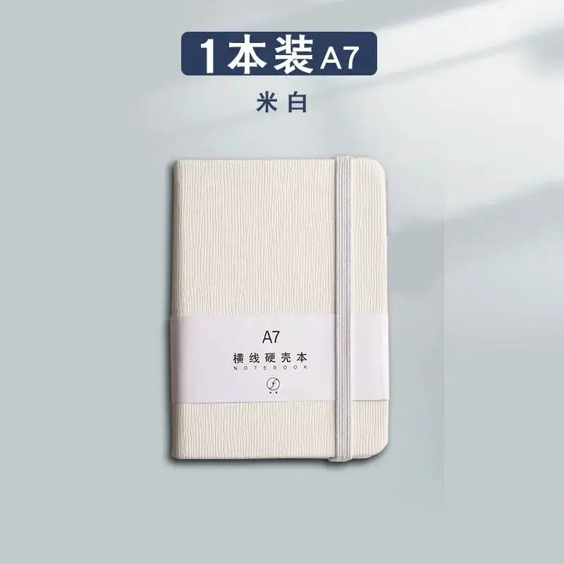 A7 mini notebook with cream textured cover and elastic strap