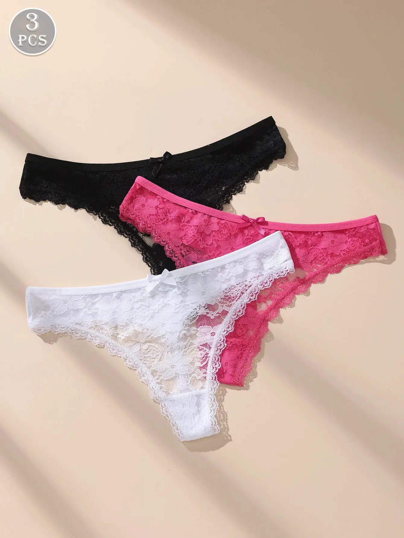 Simples Market Awesomea lace briefs 3-pack in black, pink, and white with floral lace and bows.