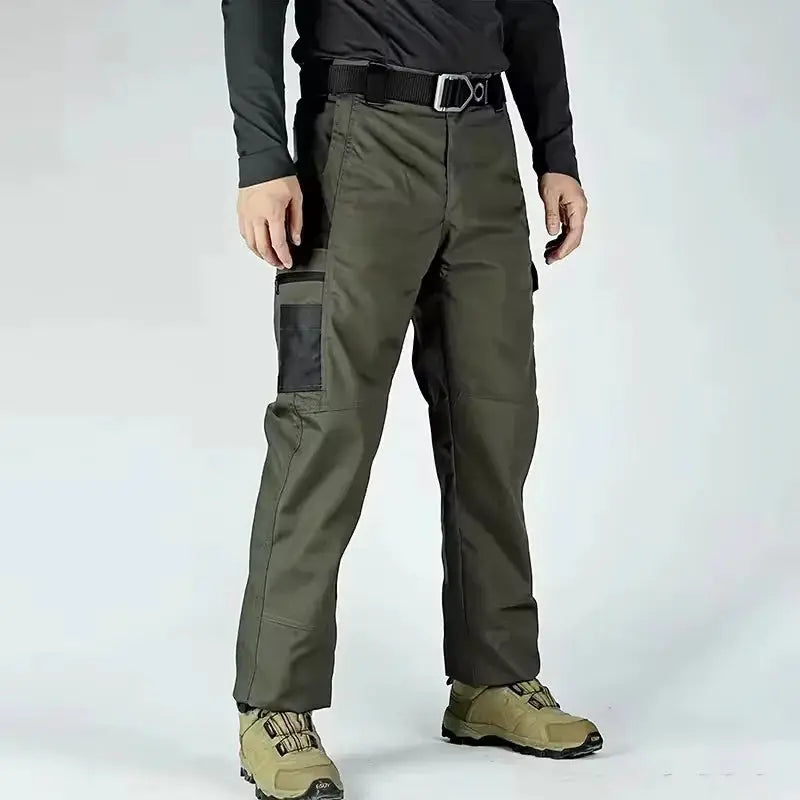 Simples Market olive green cargo work pants with multiple pockets and knee patches.