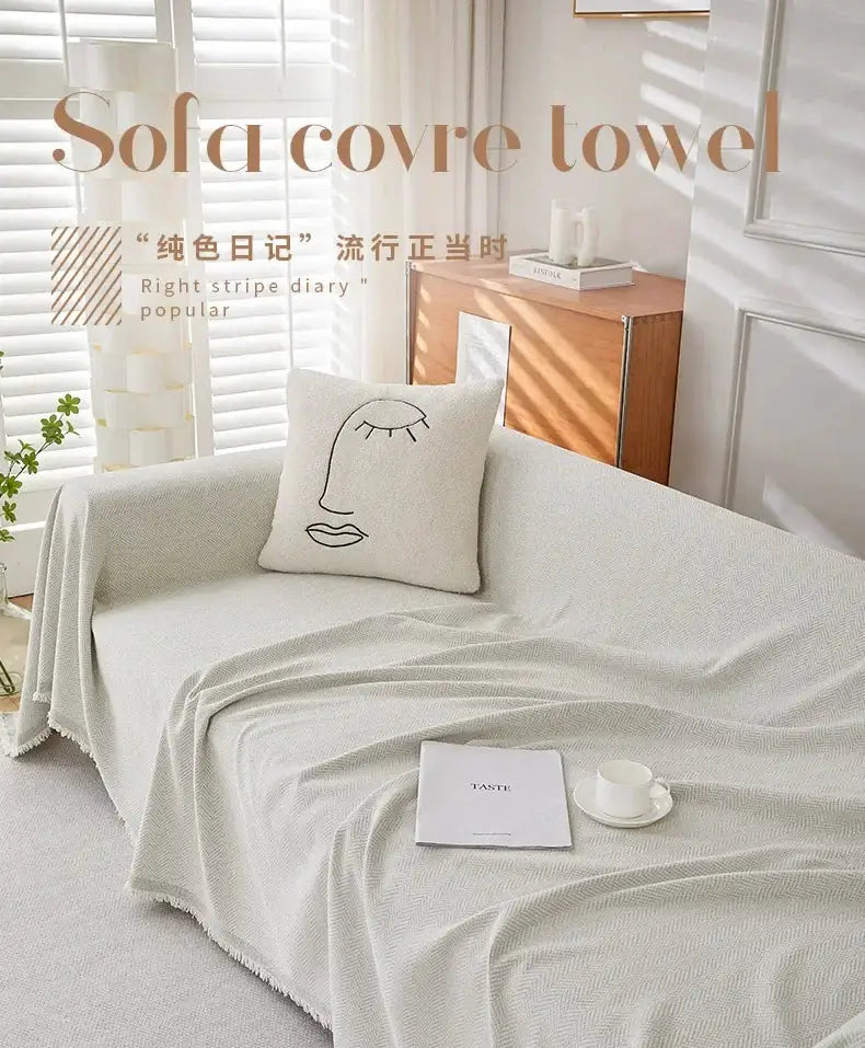 Couch cover by Simples Market in light gray chenille with fringe, herringbone texture for sofa and bed decor.