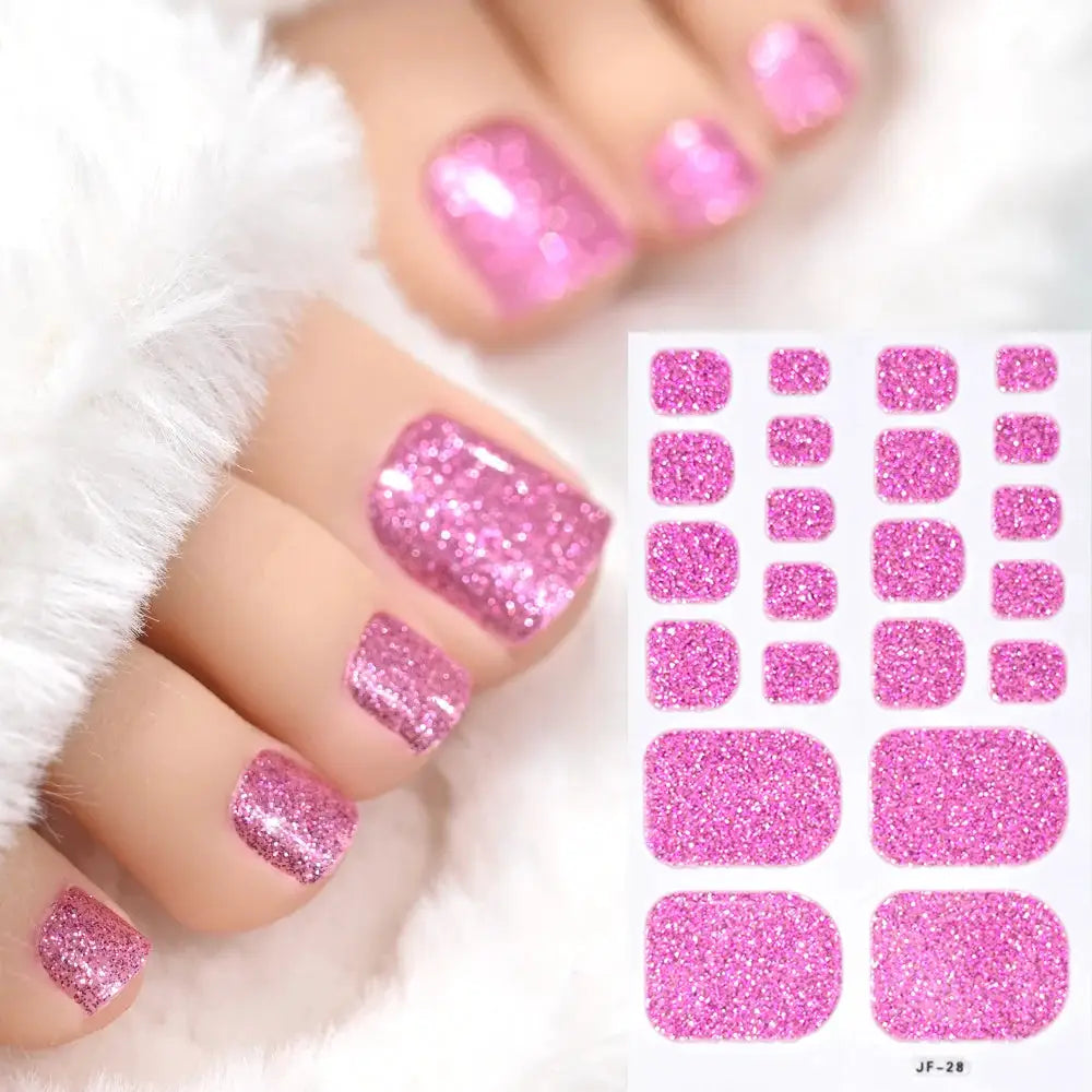 Pink glitter toe nail wrap stickers set (20 pieces) on white sheet; full-cover, self-adhesive decals