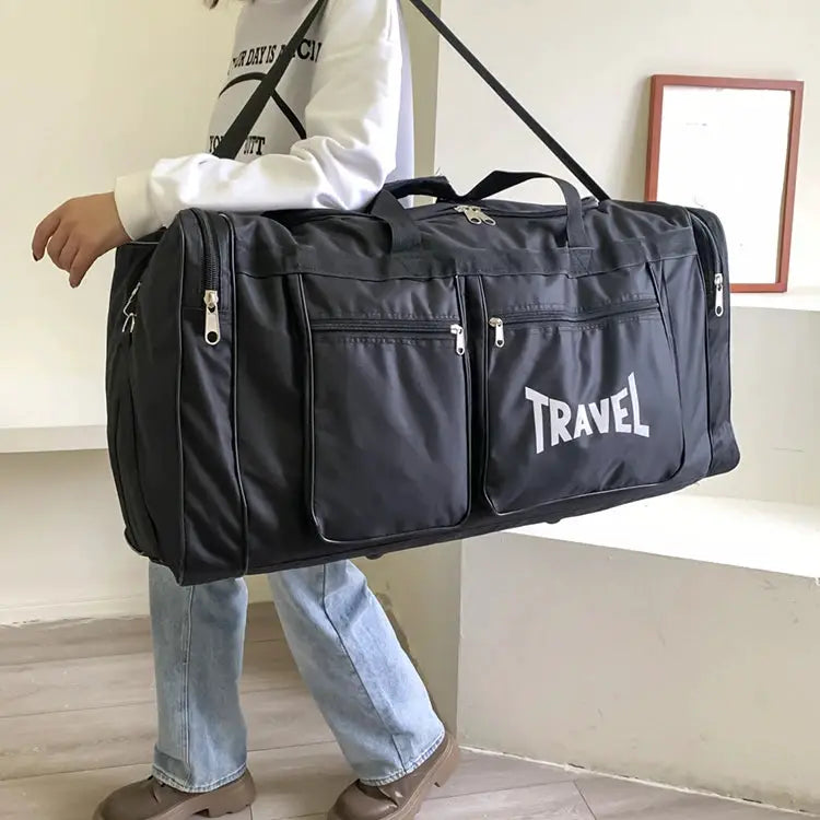 Simples Market travel bag, large-capacity black luggage with multiple zip pockets and shoulder strap.