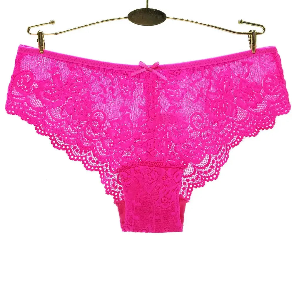 Women's hot pink lace thong panties, low-rise with floral pattern and breathable fabric.