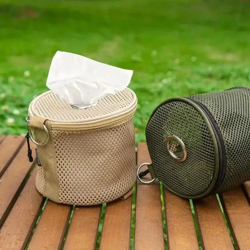 Two mesh camping tissue cases in beige and green with hooks; portable tissue holders for tents