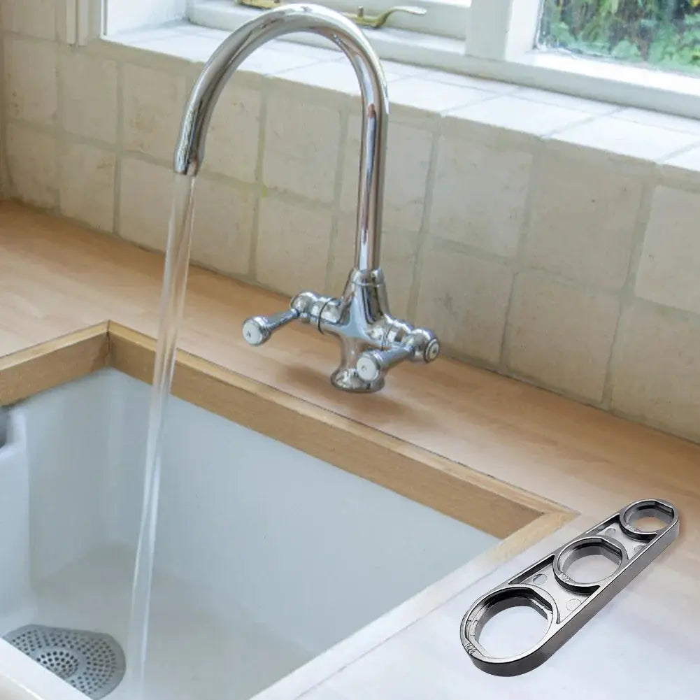 6-in-1 faucet wrench tool in chrome finish beside a chrome kitchen faucet