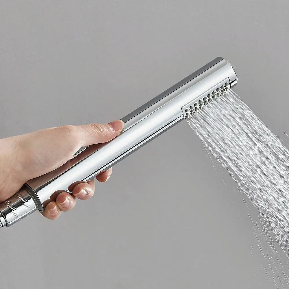 Chrome handheld shower head with long handle, water spraying from nozzle array