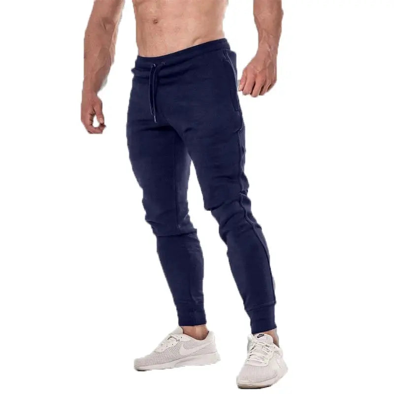 Men's navy joggers with drawstring waist and ribbed cuffs, athletic fitness sweatpants.