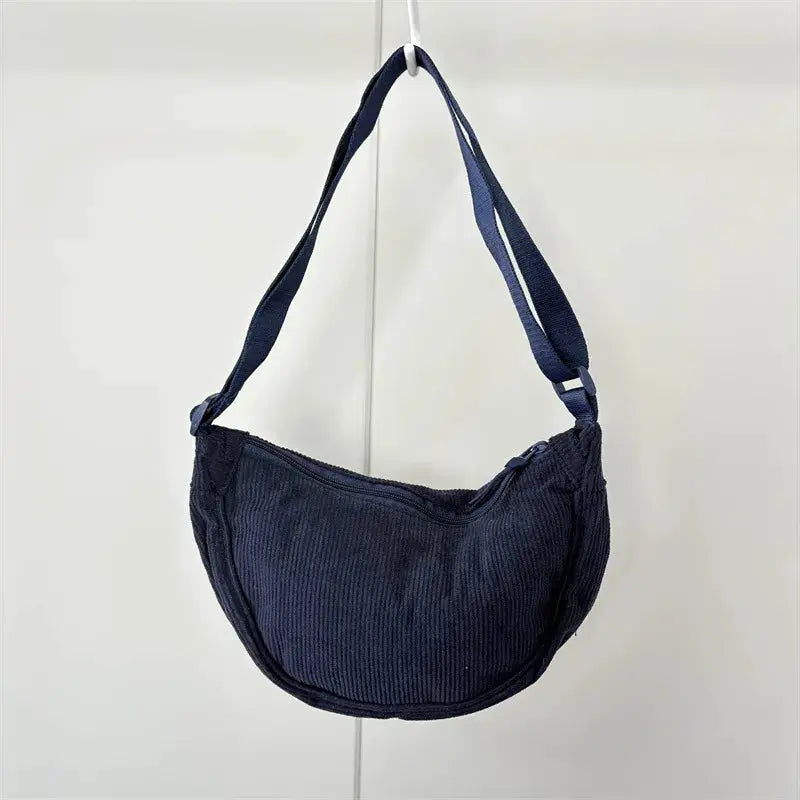 Corduroy hobo shoulder bag in navy with a long strap; casual crossbody daily travel handbag