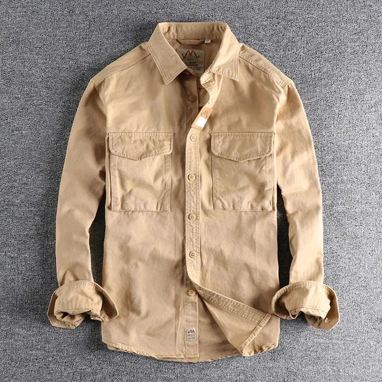 Simples Market khaki work shirt with two chest pockets, button-front, and rolled sleeves.