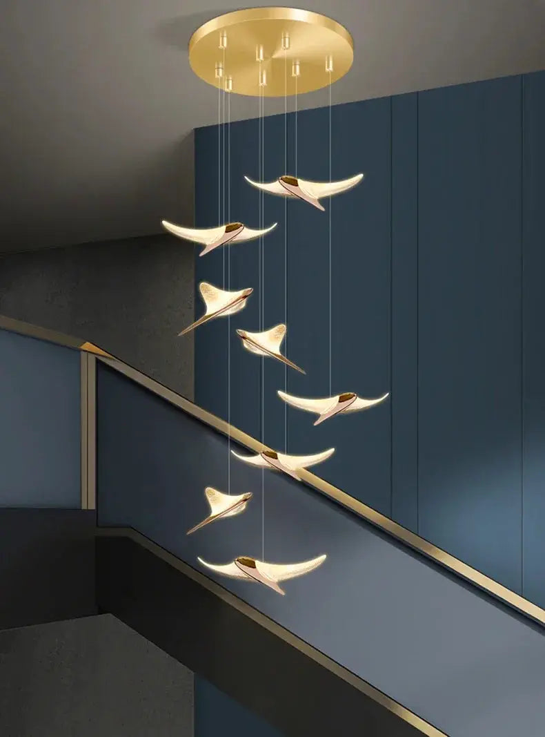 Seagull staircase pendant lamp by Simples Market in goldfinish, long modern hanging light for stairwell