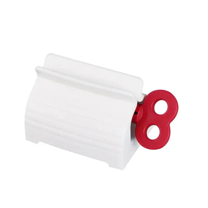 Toothpaste tube squeezer, white plastic body with red dual-loop handle