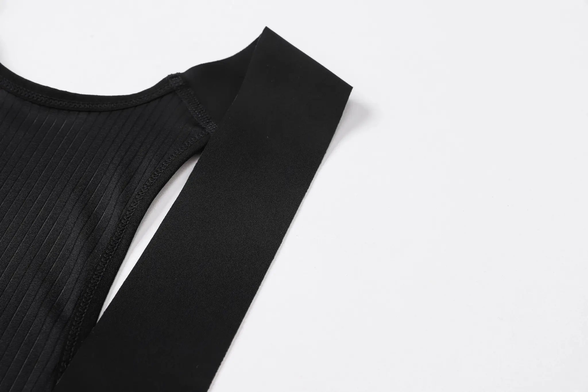 Cycling bib shorts, black with ribbed side panel and stitching.