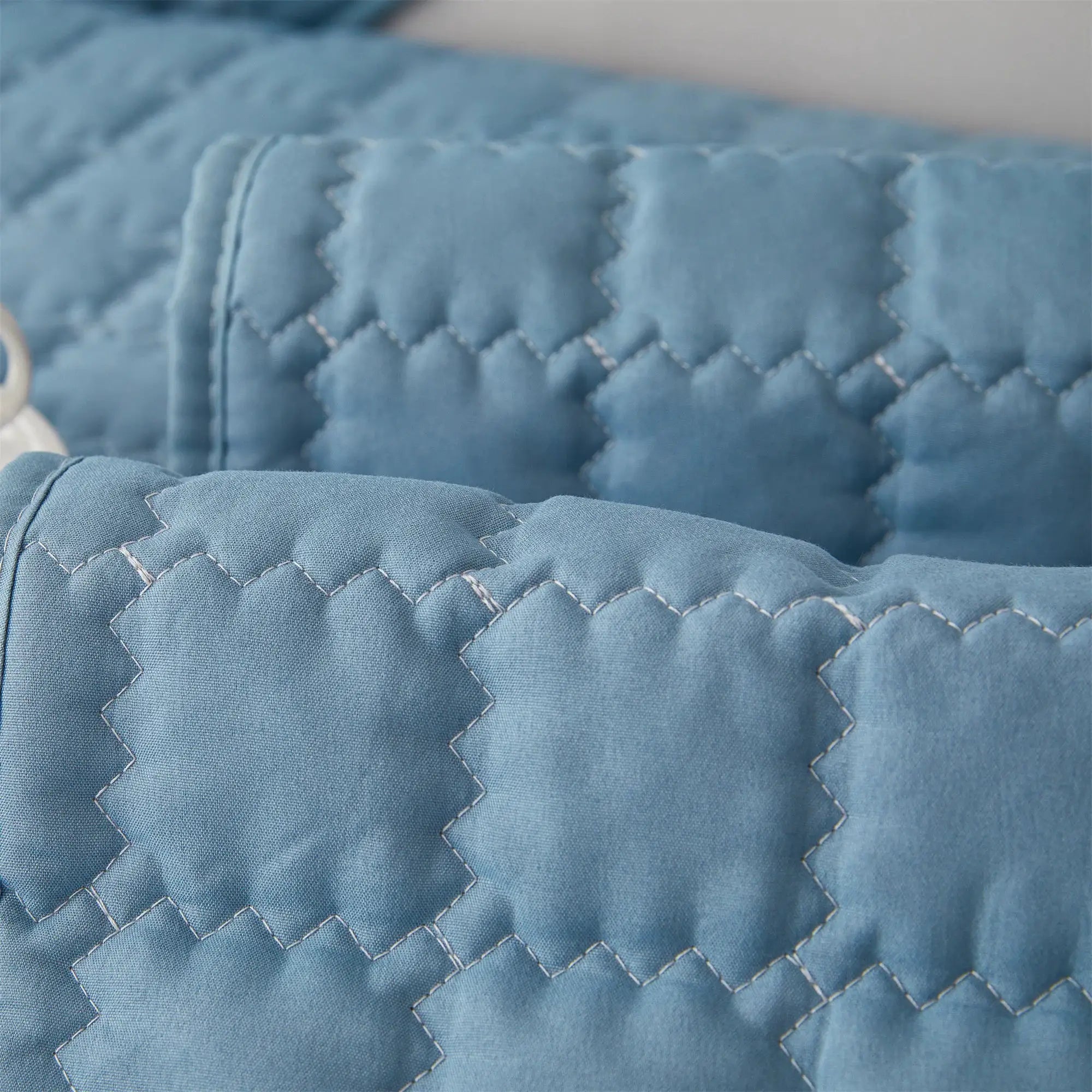 1pc blue solid quilted sofa slipcover by Simples Market with anti-slip backing