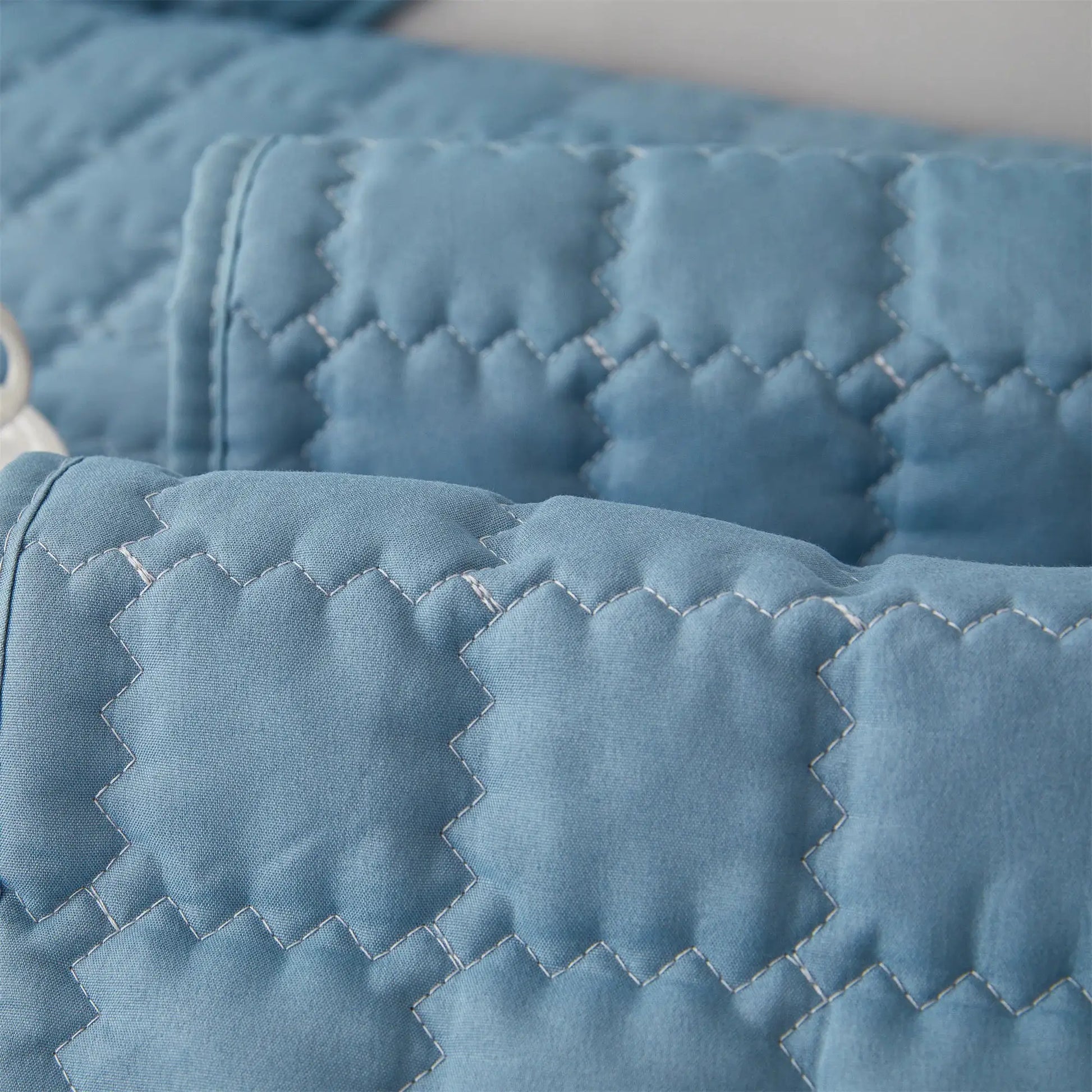 Blue quilted sofa slipcover with anti-slip backing for living room and bedroom