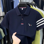 Men's navy polo shirt with puppy embroidery and white striped cuffs