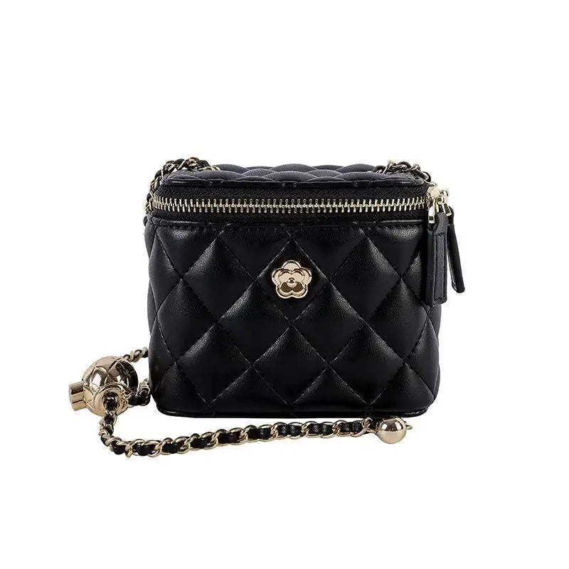 Mini quilted shoulder bag by Simples Market, black with gold chain and camellia emblem