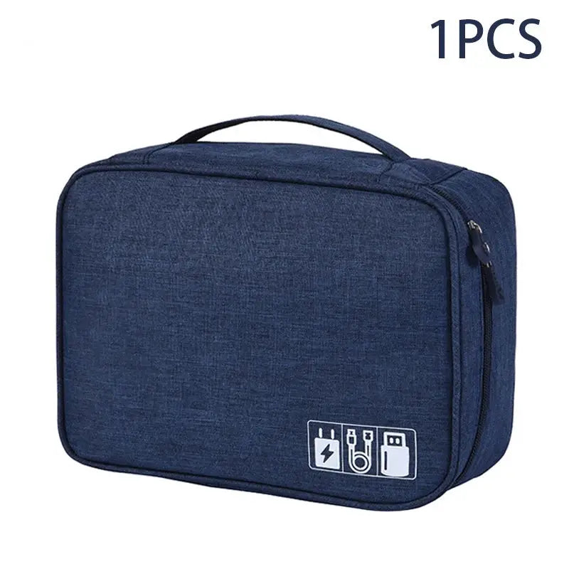 Travel cable storage bag in navy blue waterproof fabric with top handle and zip closure, USB data cable charger pouch