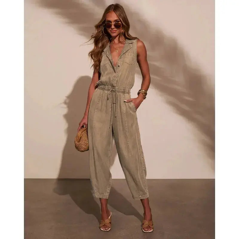 Women's sleeveless denim jumpsuit with drawstring waist and pockets, light wash.
