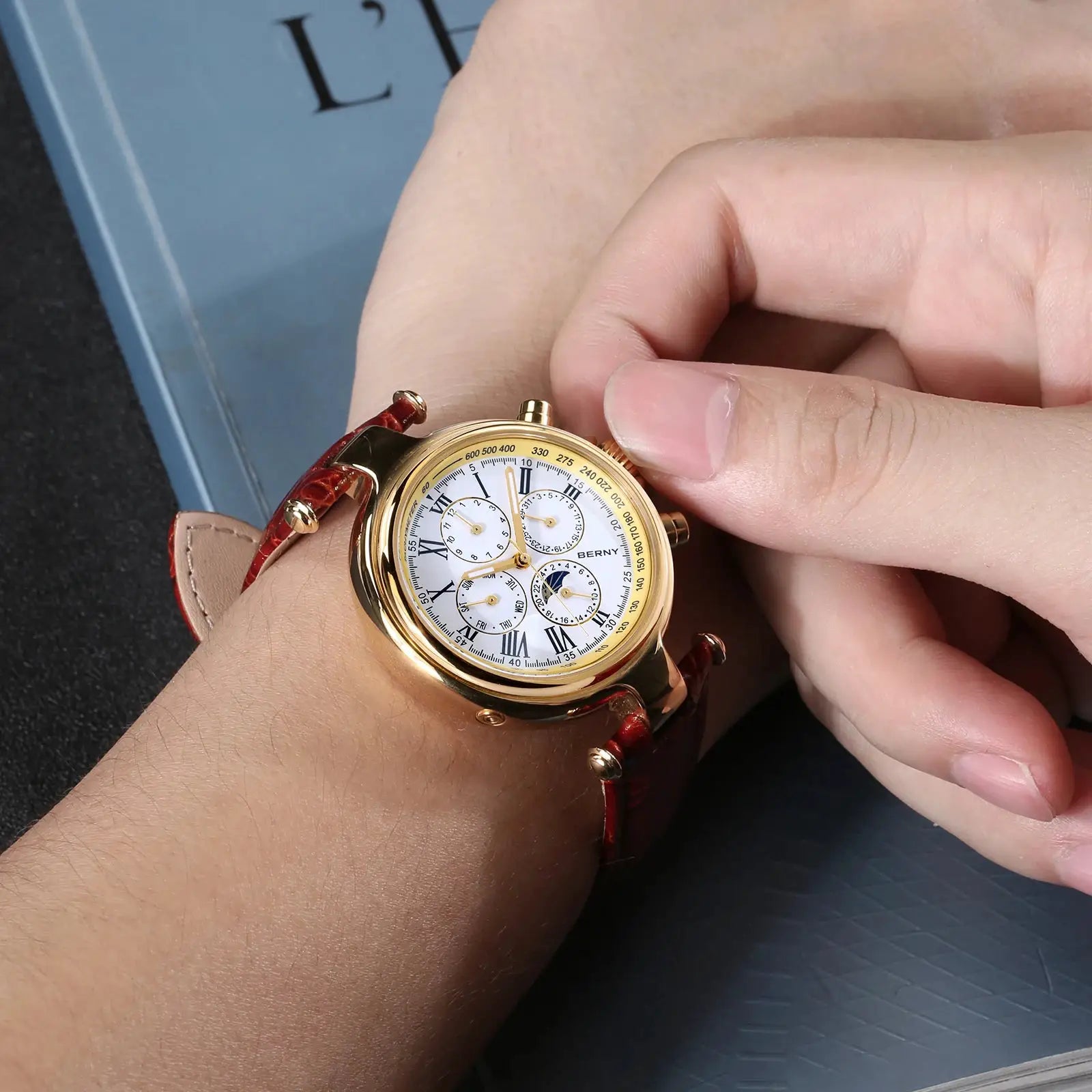 BERNY retro automatic men's watch with sun & moon phase, gold-tone case, white dial, Roman numerals, leather strap