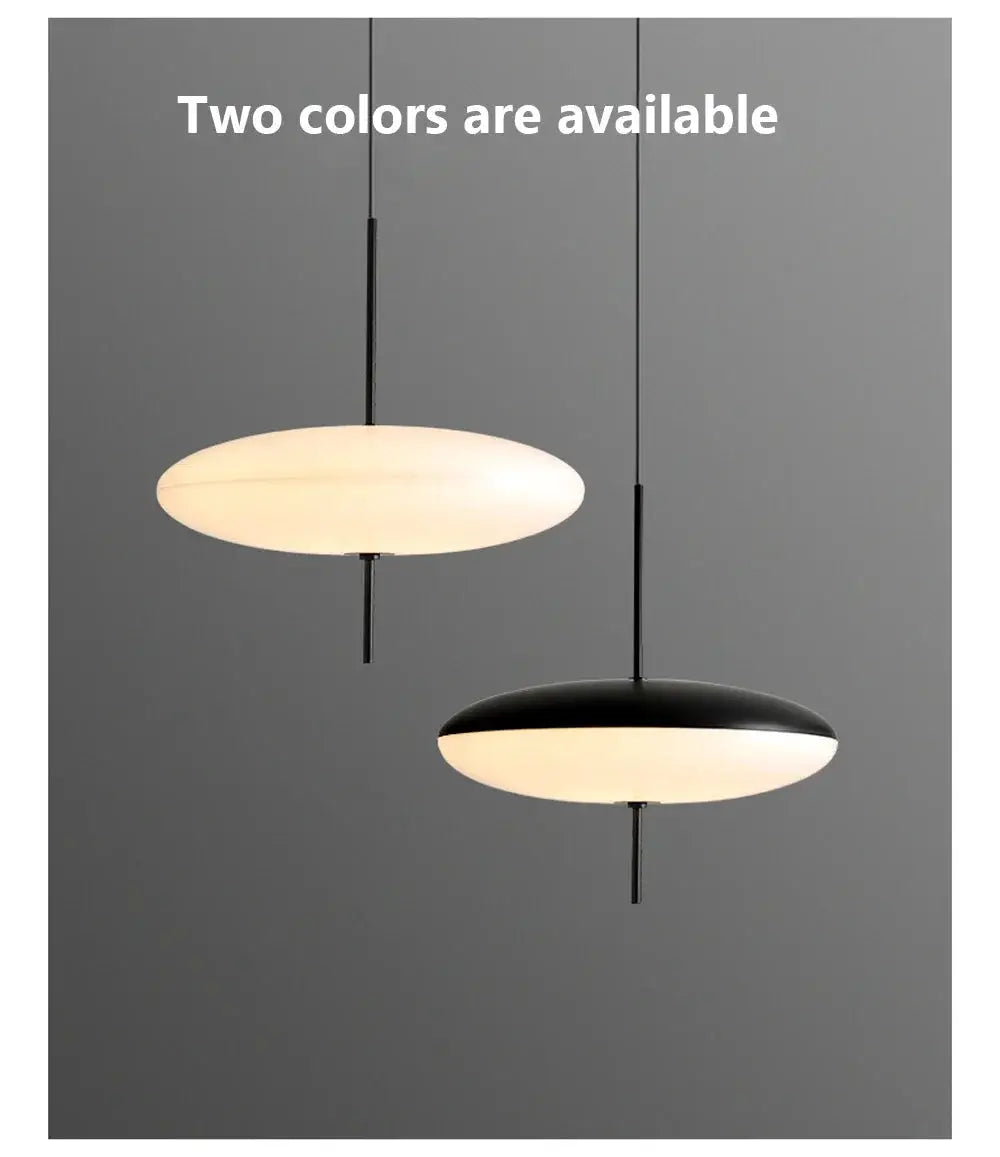Two Nordic LED pendant lights with flying saucer design in black and white, hanging discs.