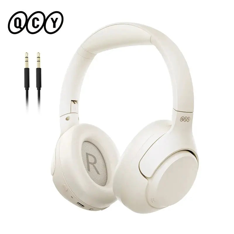 QCY H3 over-ear wireless headphones in white with 3.5mm audio cable and QCY logo