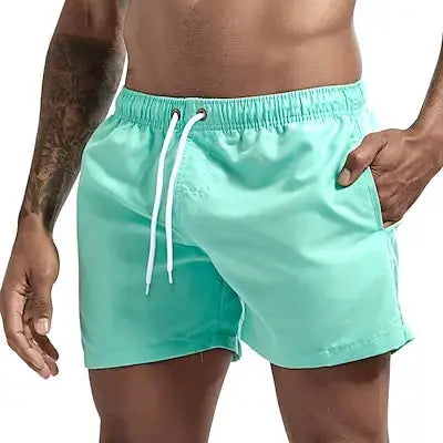 Simples Market men's mint green quick-dry board shorts with white drawstring and pockets.