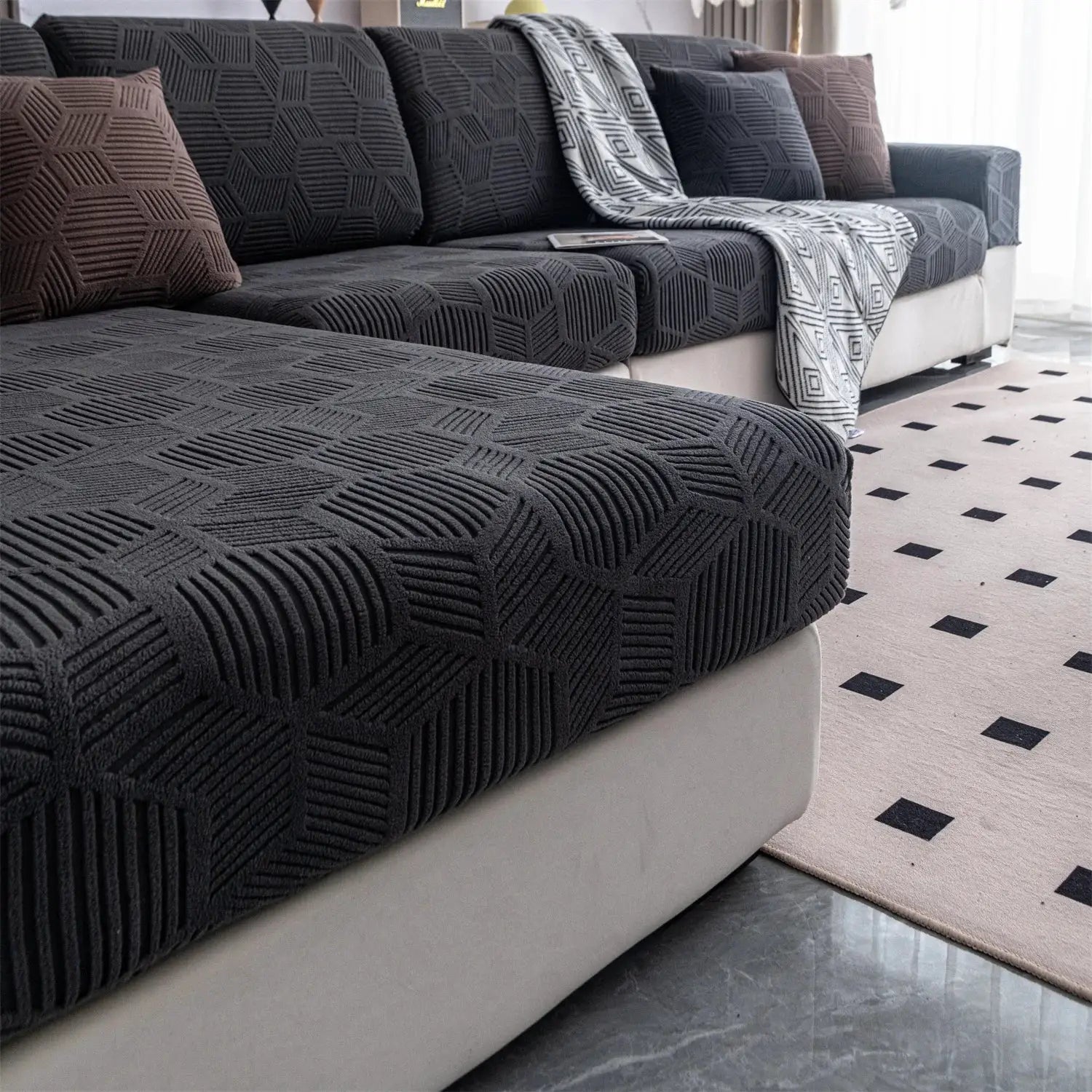 1Piece Universal Peism Jacquard Stretch Sofa Cover Cushion Cover on a dark gray geometric-patterned sofa