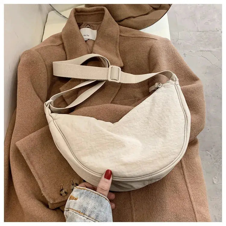 Casual nylon hobo crossbody bag by Simples Market in cream with adjustable strap, large-capacity tote.