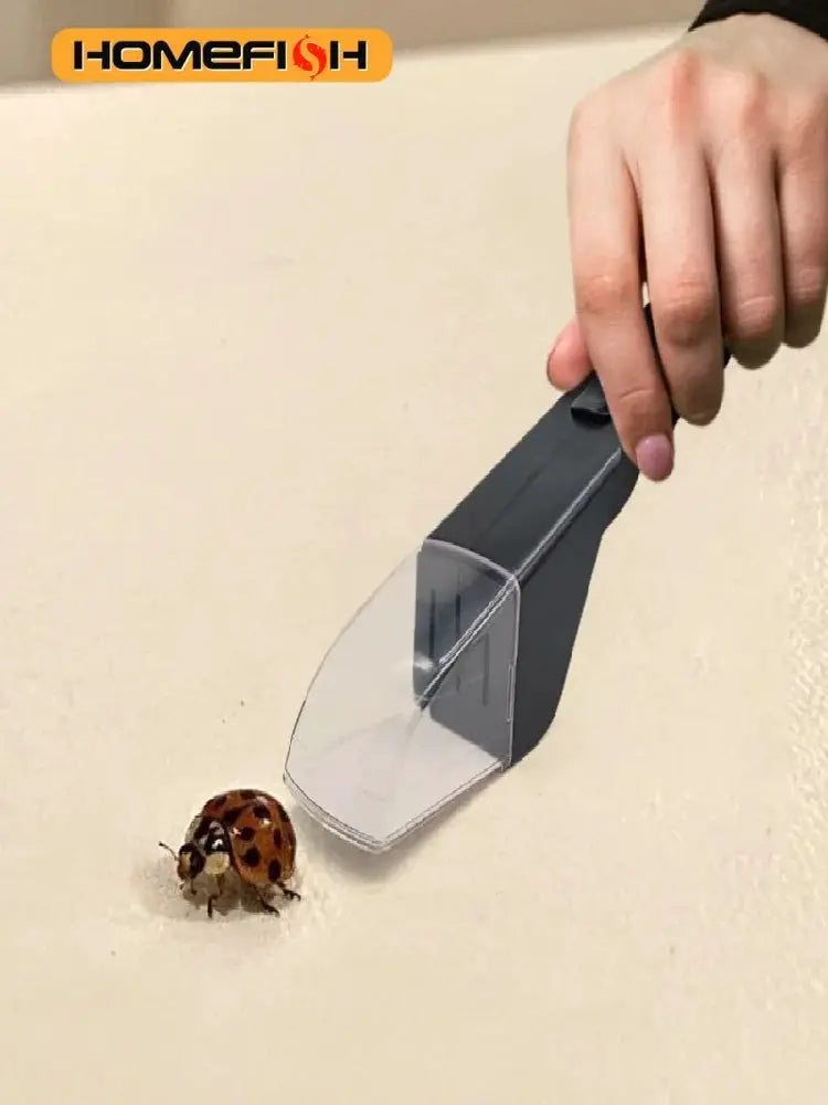 Handheld insect catcher by Simples Market, gray plastic handle with clear front scoop.