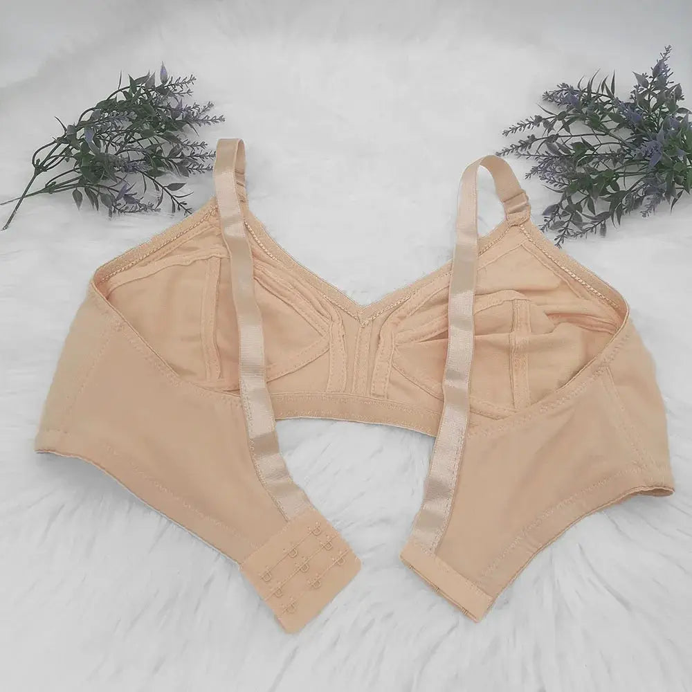 Large-size nude seamless bra with back hook closure and adjustable straps; non-padded full cup