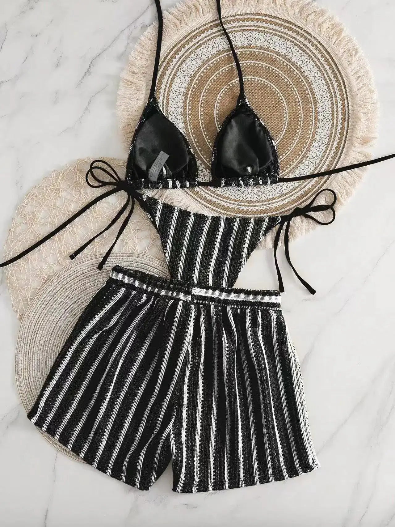 Simples Market three-piece bikini set: black triangle top with neck ties and black/white striped high-waisted bottom