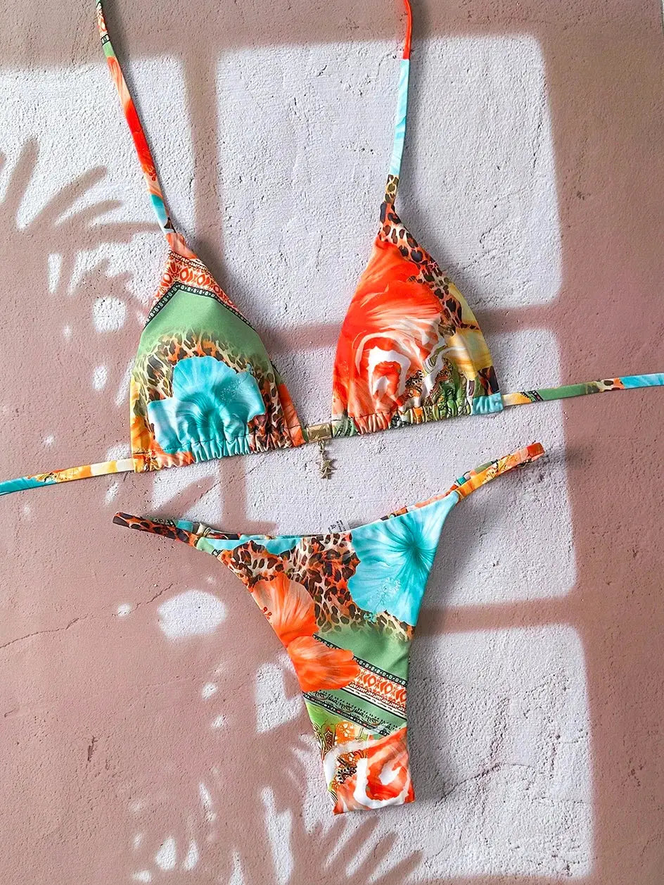 Two-piece bikini swimsuit with triangle top and thong bottom in orange, teal and leopard-print pattern