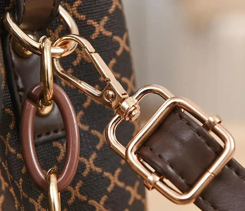 Simples Market women’s bucket crossbody handbag in check print with brown leather strap and gold hardware