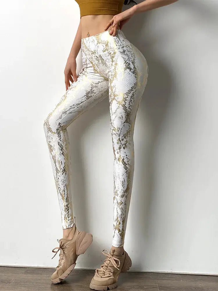 Snake-print yoga pants by Simples Market, white and gold high-waist leggings with a slim fit