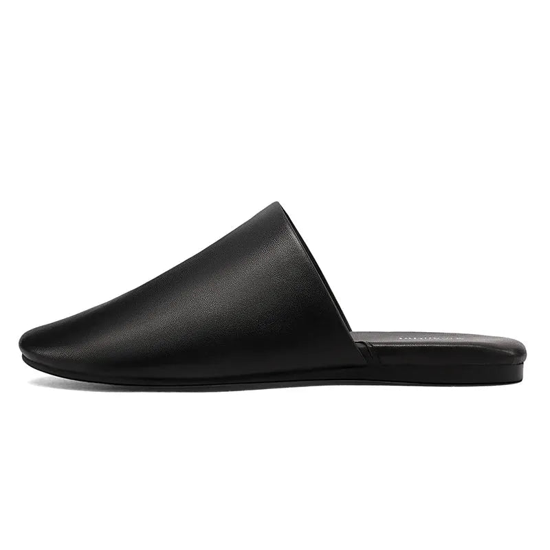 Womens black leather mule slipper with closed toe and flat sole
