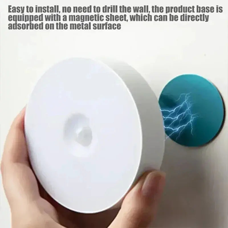White circular motion-sensor USB rechargeable night light with magnetic base for metal surfaces