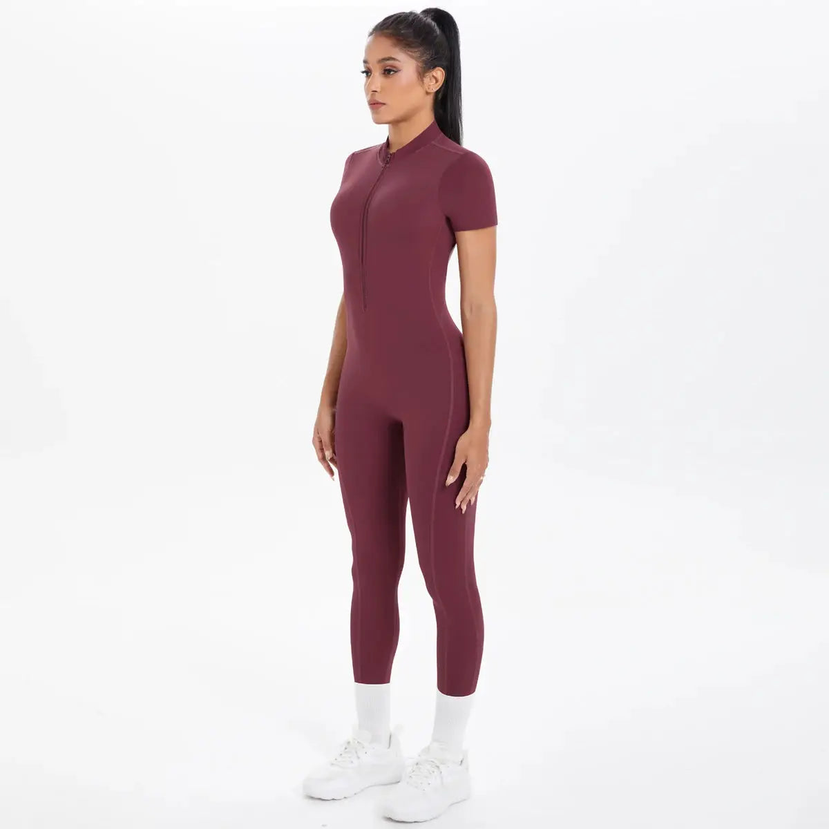 Fitness jumpsuit for women, burgundy short-sleeve solid color one-piece with front zipper.