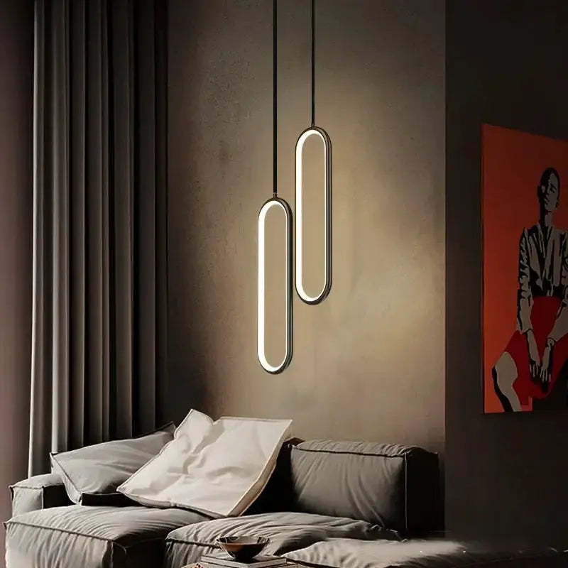 Modern minimalist LED pendant light chandelier, gold and black oval hanging lamps, two fixtures in the living room