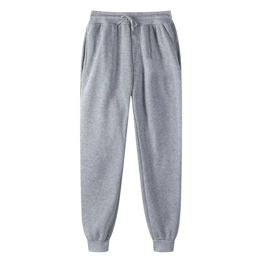 Sweatpants in grey with drawstring, side pockets, and ribbed cuffs for unisex athletic wear.