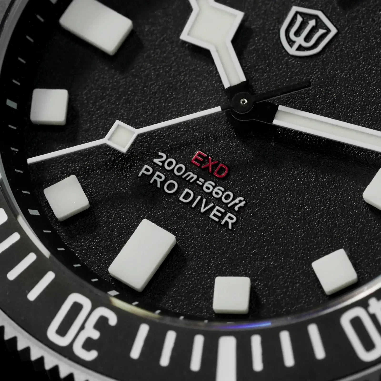 Watchdives EXD 40mm titanium dive watch dial close-up; white luminescent hands and markers, 200m water resistant