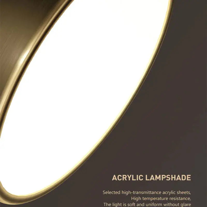 Acrylic lampshade LED ceiling light with round copper finish; close-up view of warm glow.