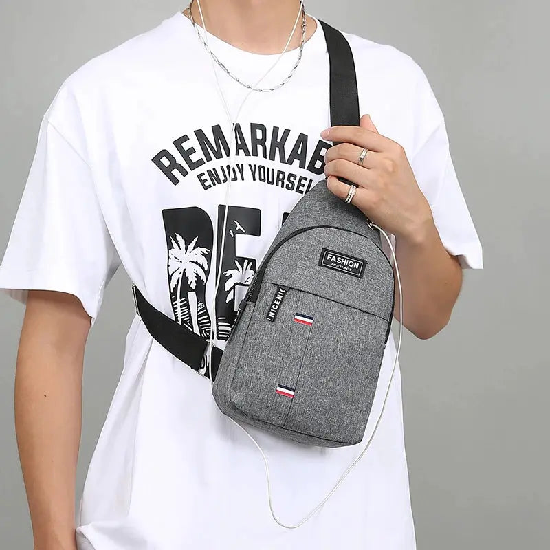 Chest bag men's grey crossbody with black strap, large-capacity fashion sling with front patches.