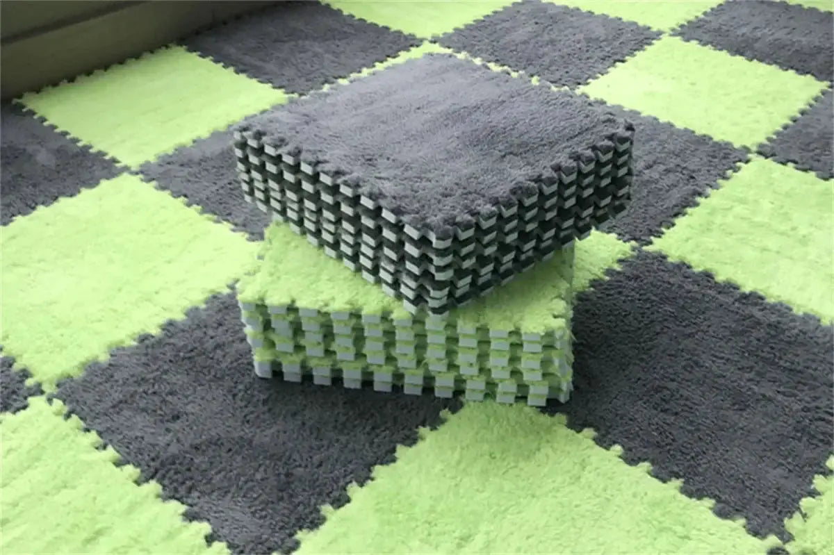 Soft plush EVA foam interlocking puzzle mats, two stacks in lime green and gray, 30 cm square tiles.