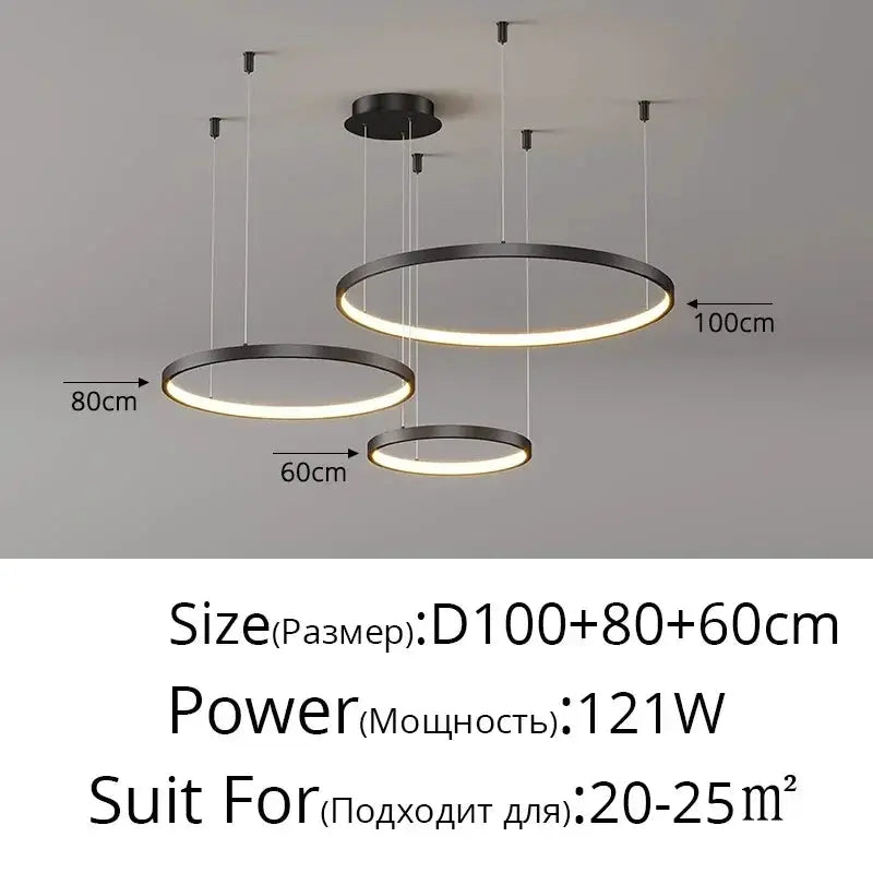 Minimalist circular LED pendant lights set of three in black metal with warm glow; ring sizes 100 cm, 80 cm and 60 cm
