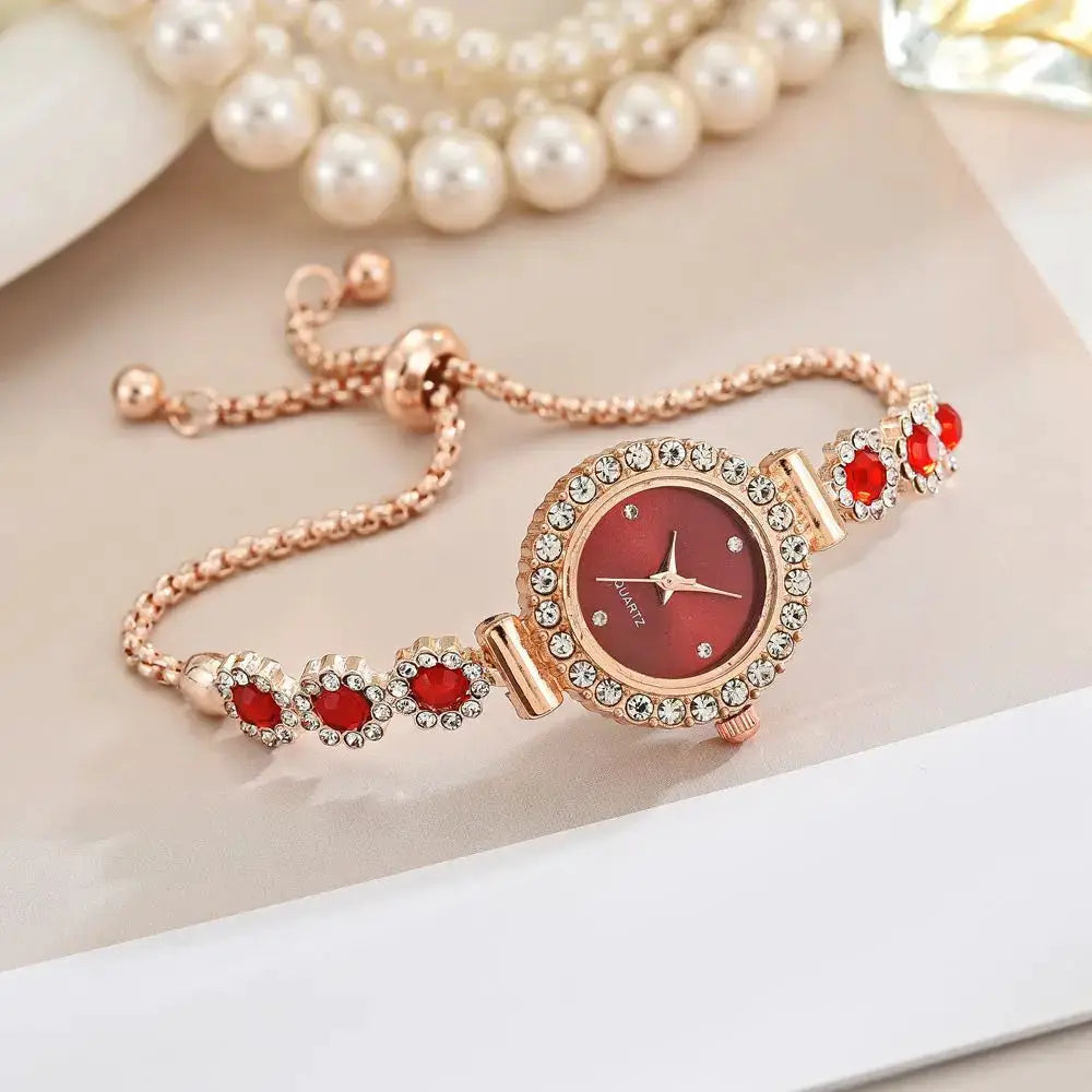 Watch by Simples Market: rose-gold bracelet with rhinestones, red gemstone accents and crystal-studded bezel